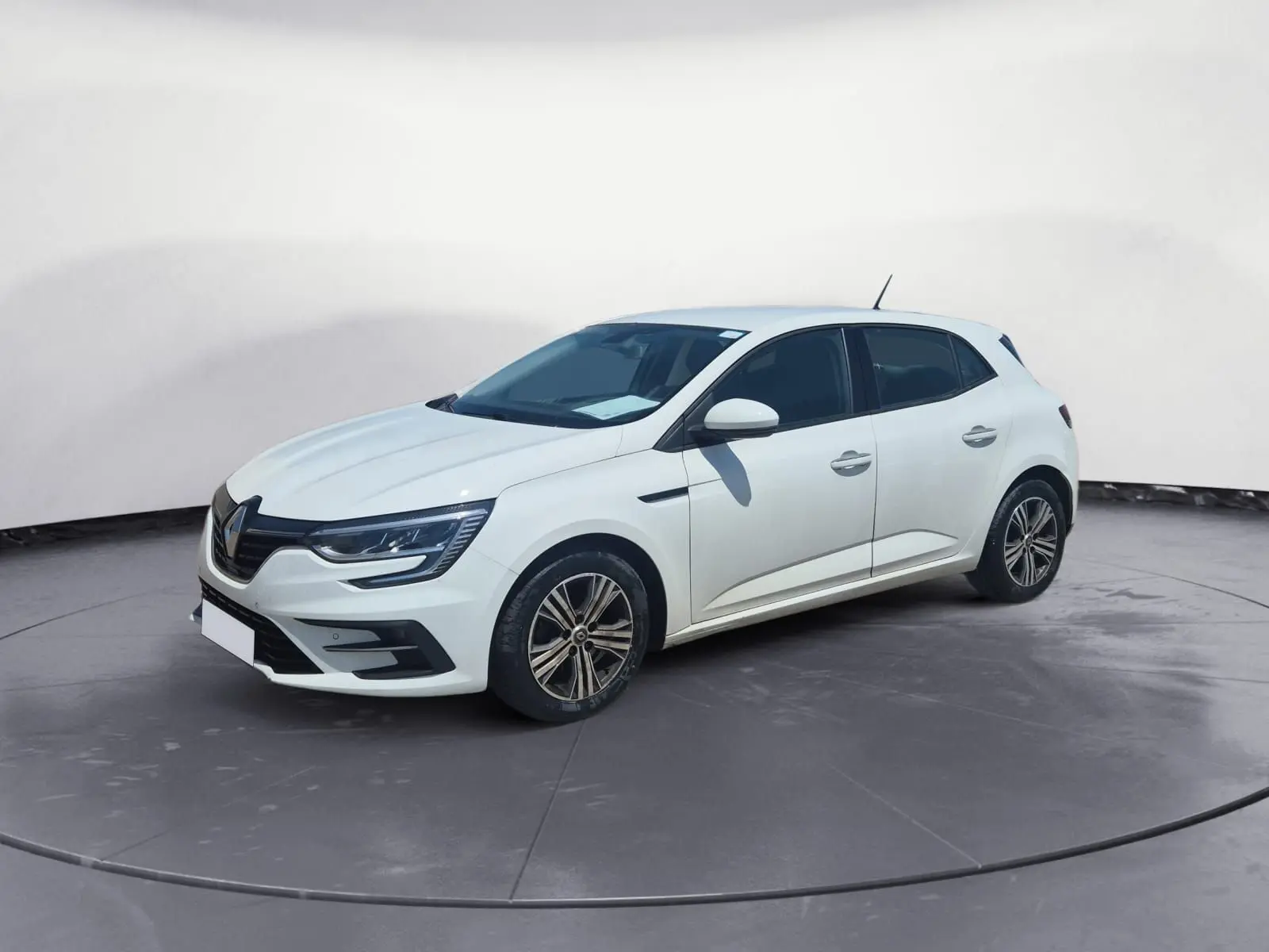 Renault Mégane 1.5 Blue dCi 115 Evolution blanche vue en 3/4 avant, avec phares LED et jantes alliage 16 pouces.