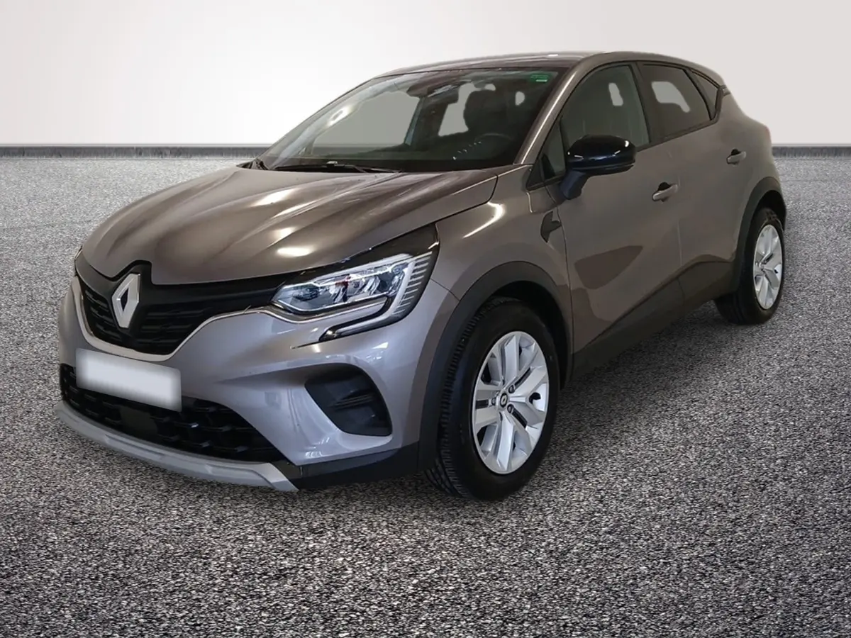 Renault Captur gris foncé vue 3/4 avant droit, mettant en valeur ses phares LED et sa calandre noire distinctive.