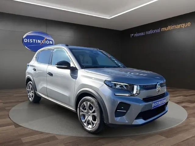 SUV Citroën C3 Turbo 100 BVM6 gris foncé, vue 3/4 avant droite, avec toit et rétroviseurs noirs.