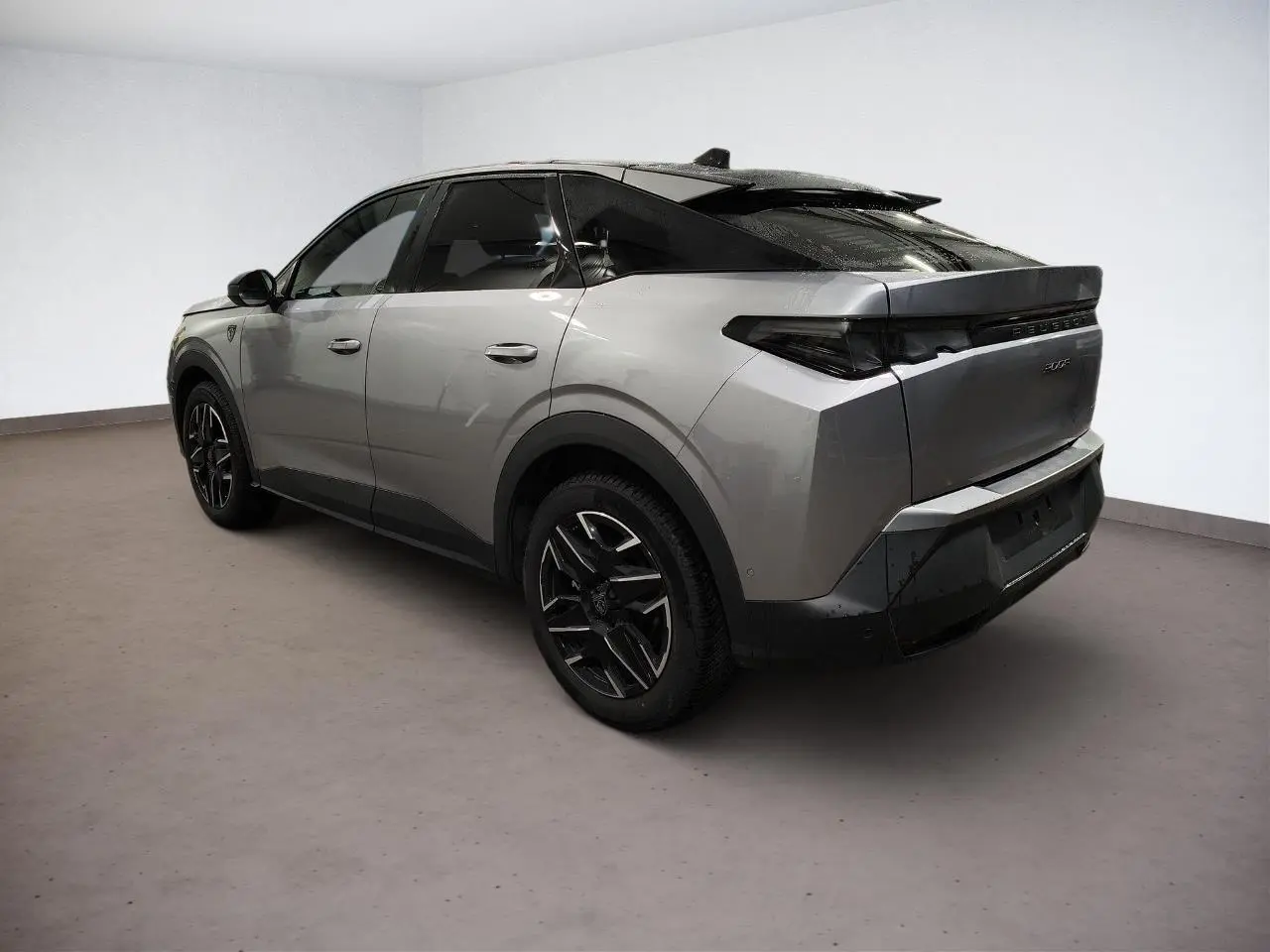 Peugeot 3008 Hybrid gris Artense vue 3/4 arrière droit avec toit noir et jantes alliage noires.