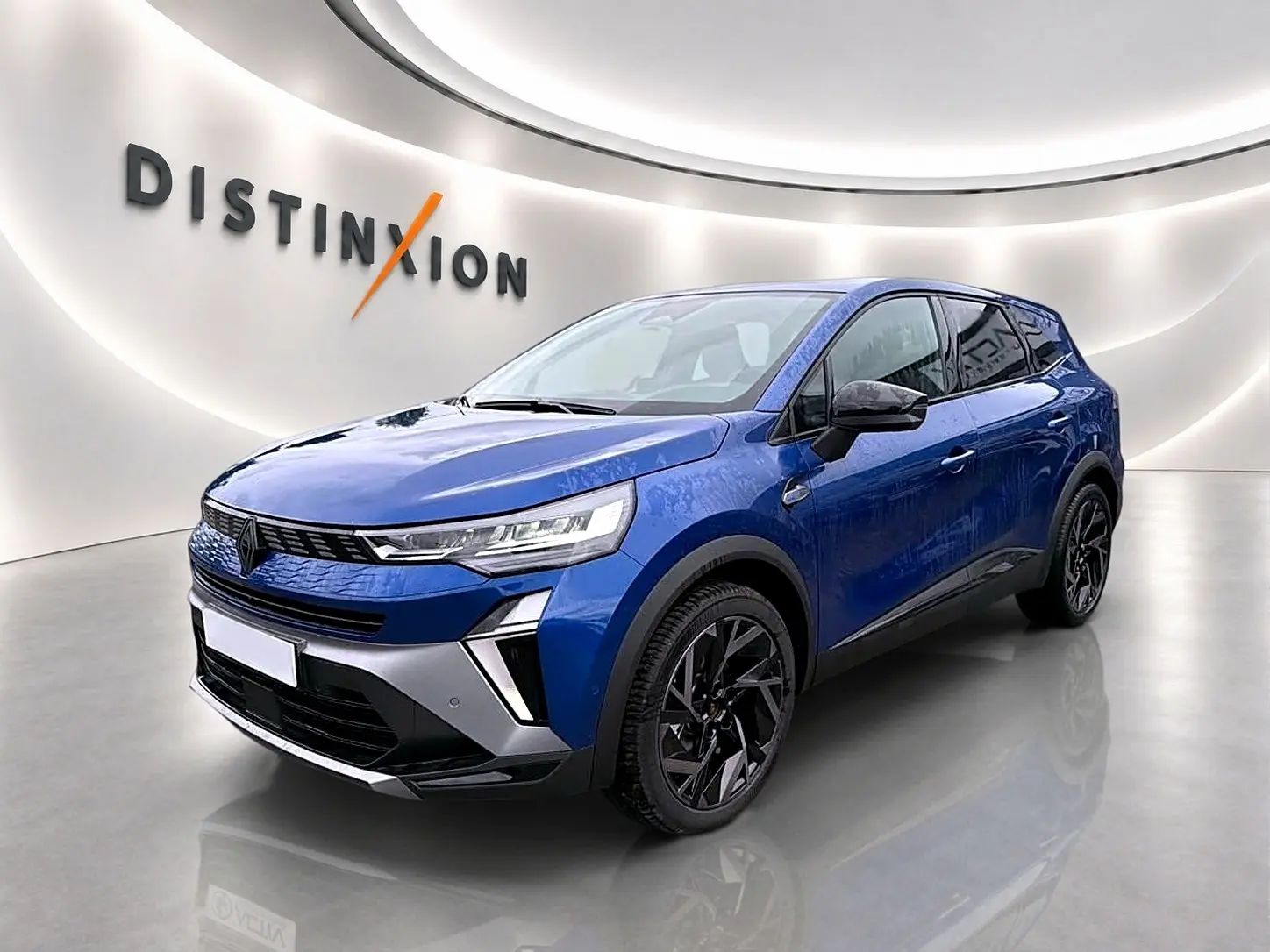 Renault Symbioz 2026 bleu iron en 3/4 avant droit, avec jantes noires et signature lumineuse LED distinctive.