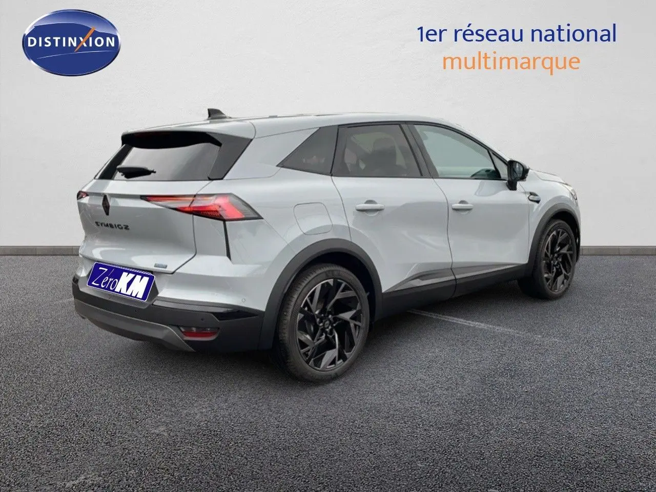 Renault Symbioz gris Rafale métal vu en 3/4 arrière droit avec jantes noires et lignes modernes distinctives.