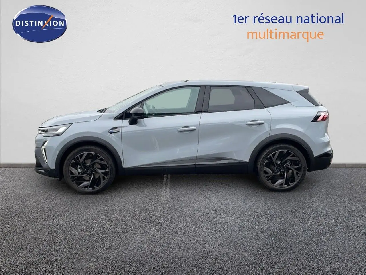 Profil latéral droit du Renault SYMBIOZ gris Rafale Métal avec jantes noires et lignes dynamiques marquées.