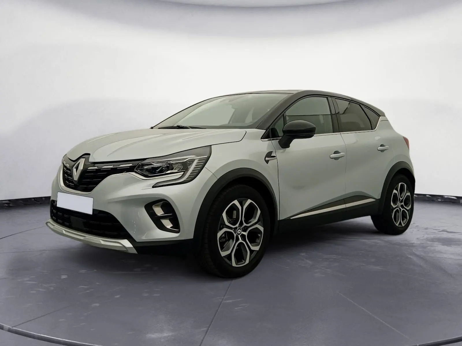Renault Captur E-Tech hybride 2023 gris alu/noir en 3/4 avant droit, avec jantes alliage et toit noir contrasté.