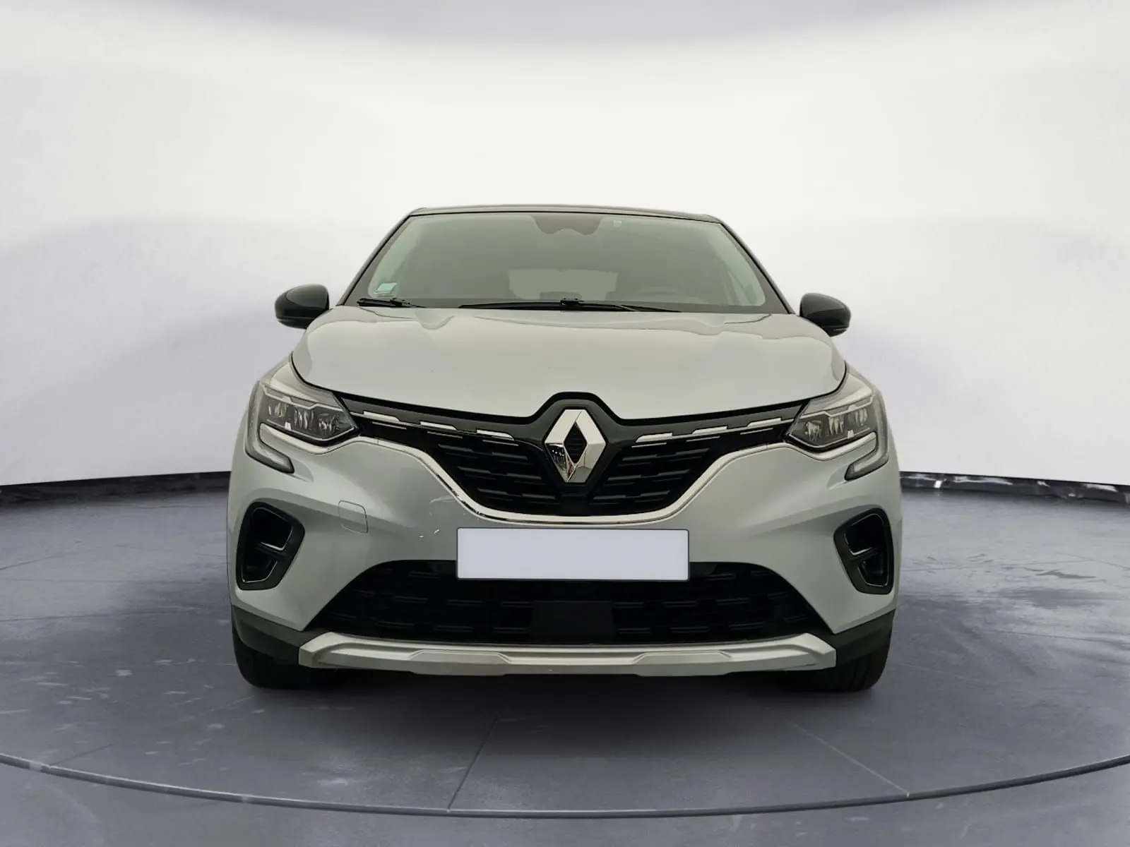 Vue avant du Renault Captur E-Tech Full Hybrid 145 Techno 2023 en gris alu avec toit noir et calandre noire distinctive.