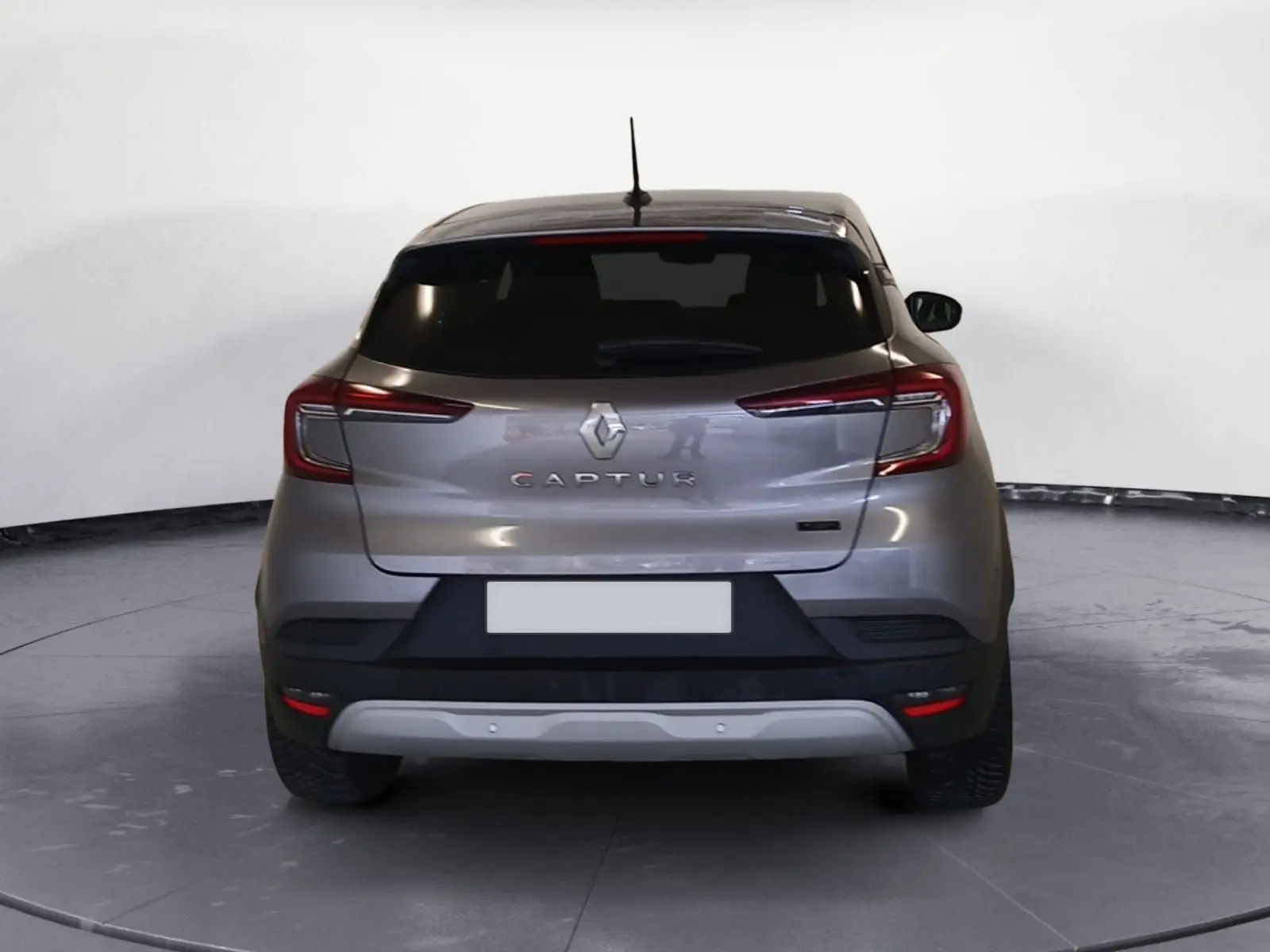 Vue arrière du Renault Captur 2023 gris Cassiopée, version E-Tech Full Hybrid 145 Evolution avec feux LED distinctifs.