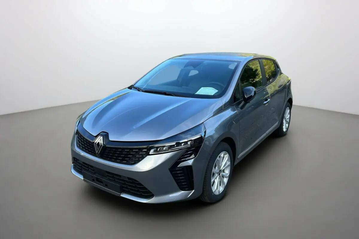 Renault Clio gris schiste vue 3/4 avant droit, feux full LED et jantes alu 16 pouces visibles.