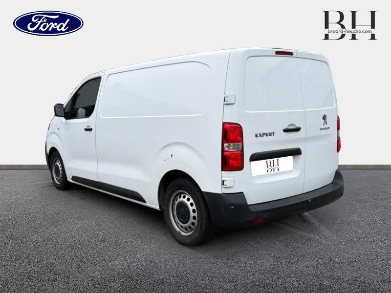 Vue 3/4 arrière droite du Peugeot Expert Fourgon blanc Banquise avec portes arrière battantes et jantes acier.