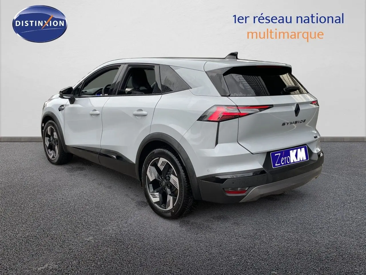Vue 3/4 arrière droite du Renault Symbioz gris Rafale métal avec feux LED et jantes distinctives.