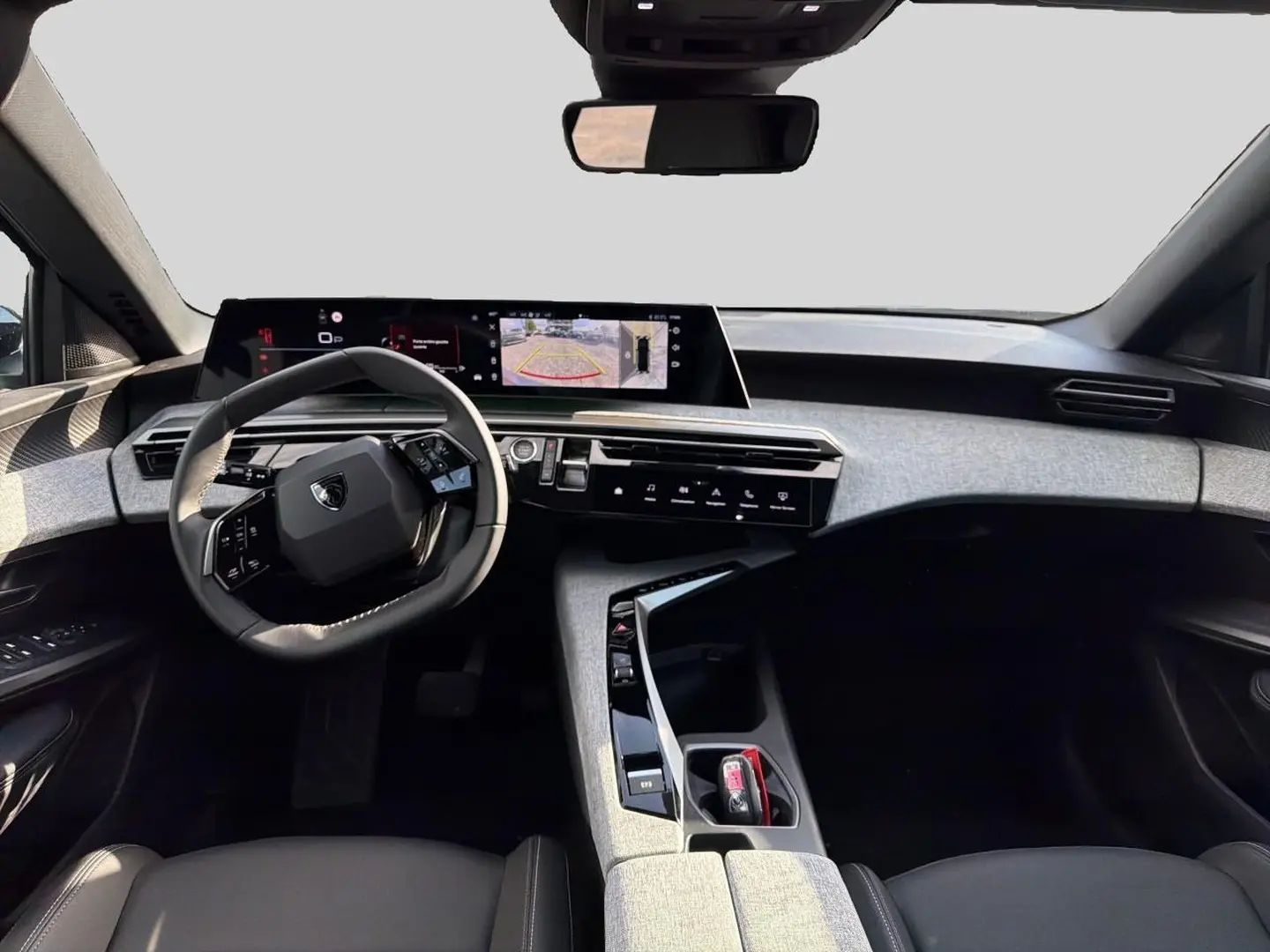 Vue intérieure avant du Peugeot 3008 1.2 hybrid 145 allure business e-dcs6 avec tableau de bord numérique et volant cuir multifonction.