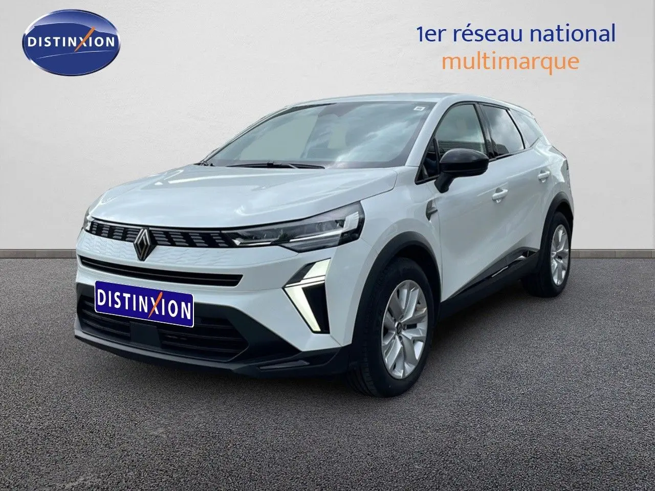 Renault Symbioz gris rafale métal en 3/4 avant droit, SUV hybride avec calandre noire et feux LED distinctifs.