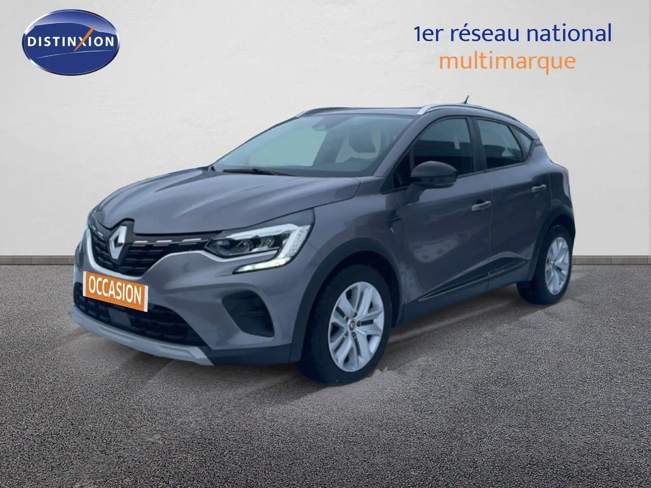 Renault Captur 1.0 TCE GPL Business gris cassiopée métal en 3/4 avant droit avec plaque occasion orange.