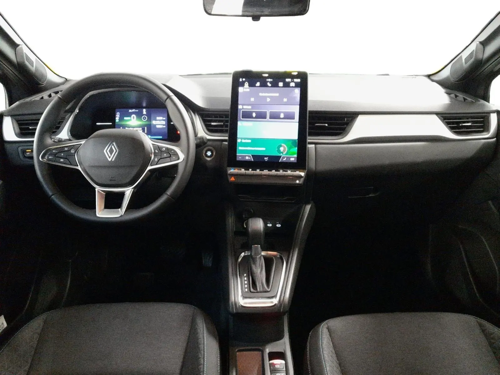 Vue intérieure avant du Renault Symbioz gris cassiopée, avec tableau de bord numérique et écran tactile vertical central.