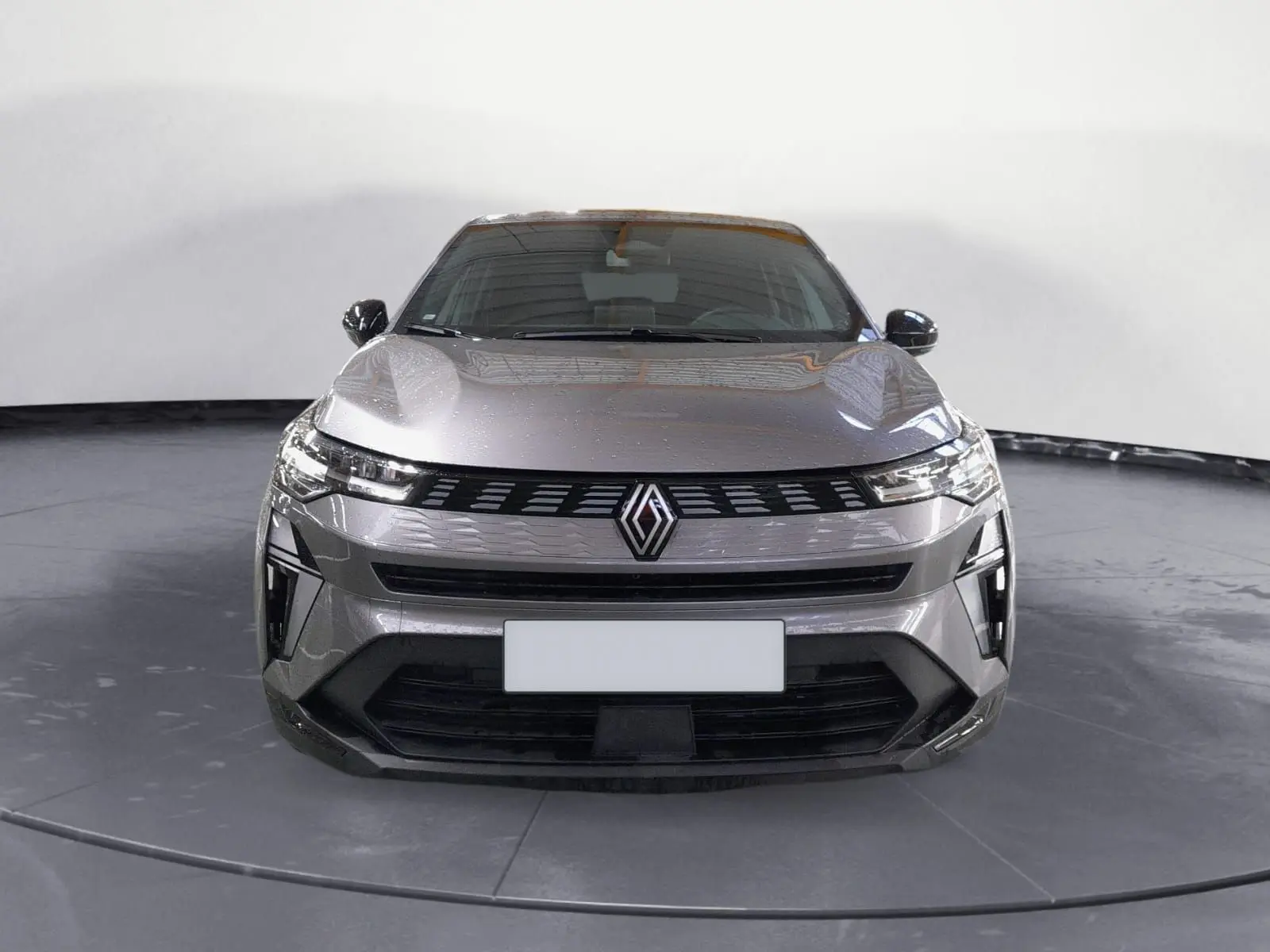 Vue frontale du Renault Symbioz E-Tech Full Hybrid 145 Evolution en gris Cassiopée avec calandre et logo distinctifs.