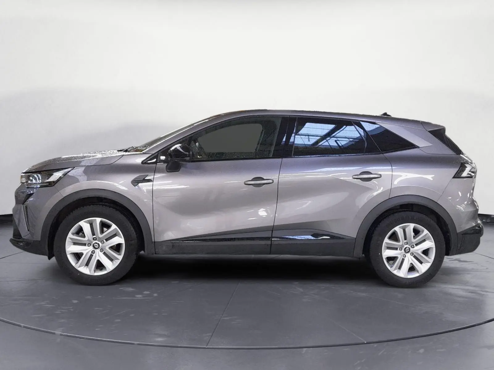 Profil côté gauche du Renault Symbioz E-Tech Full Hybrid 145 Evolution gris Cassiopée, SUV compact aux lignes fluides et modernes.