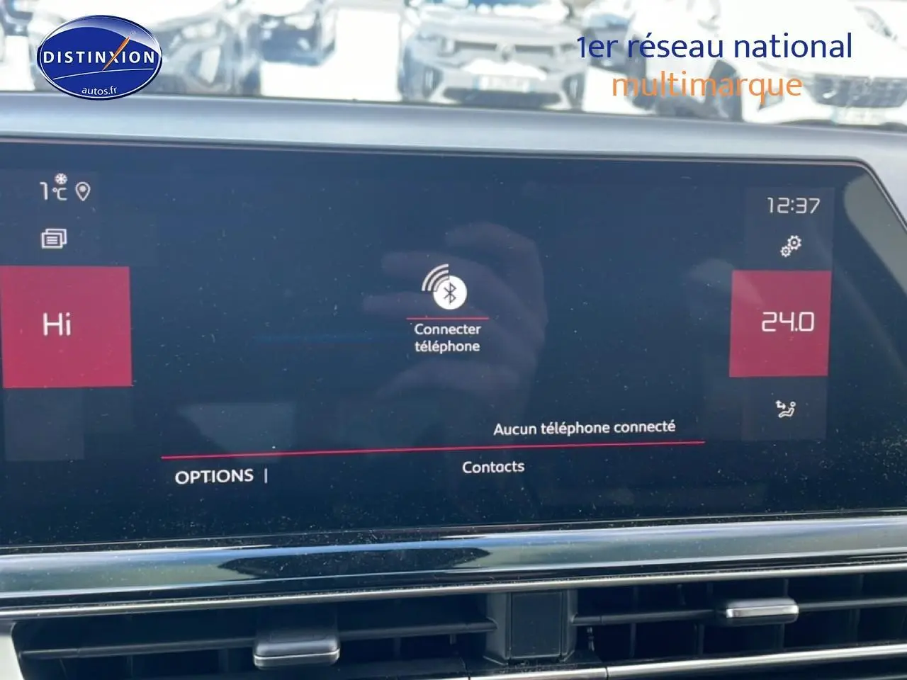 Écran tactile central du tableau de bord du Citroën C5 Aircross noir, affichant la connexion Bluetooth au téléphone.