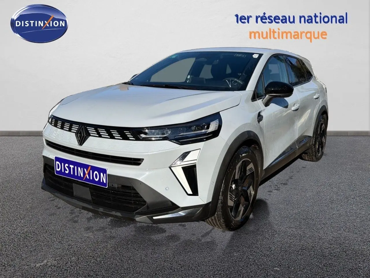 Renault Symbioz E-Tech gris rafale métal en 3/4 avant droit, avec calandre noire et jantes noires distinctives.