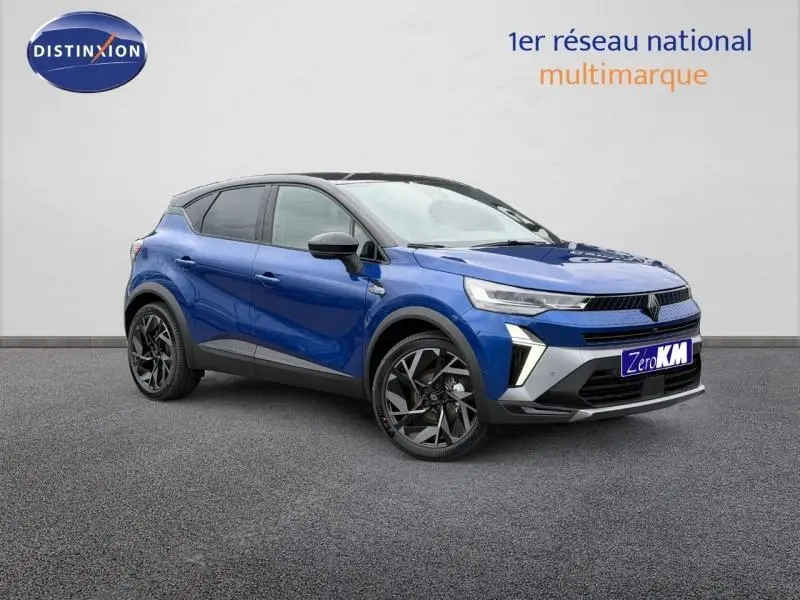 Renault Captur 1.8 E-Tech hybride 2026 en bleu Iron et noir, vue 3/4 avant avec jantes noires distinctives.
