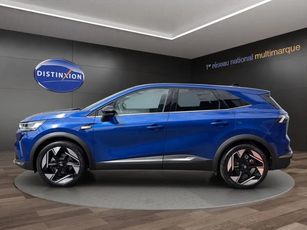 Vue profil côté gauche du Renault SYMBIOZ Iconic E-Tech 145 bleu avec jantes noires et détails argentés.