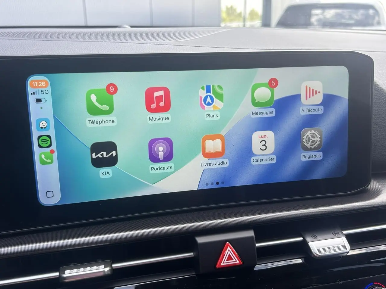 Écran tactile couleur 12,3'' du tableau de bord du Kia Sportage 2026 affichant Apple CarPlay.
