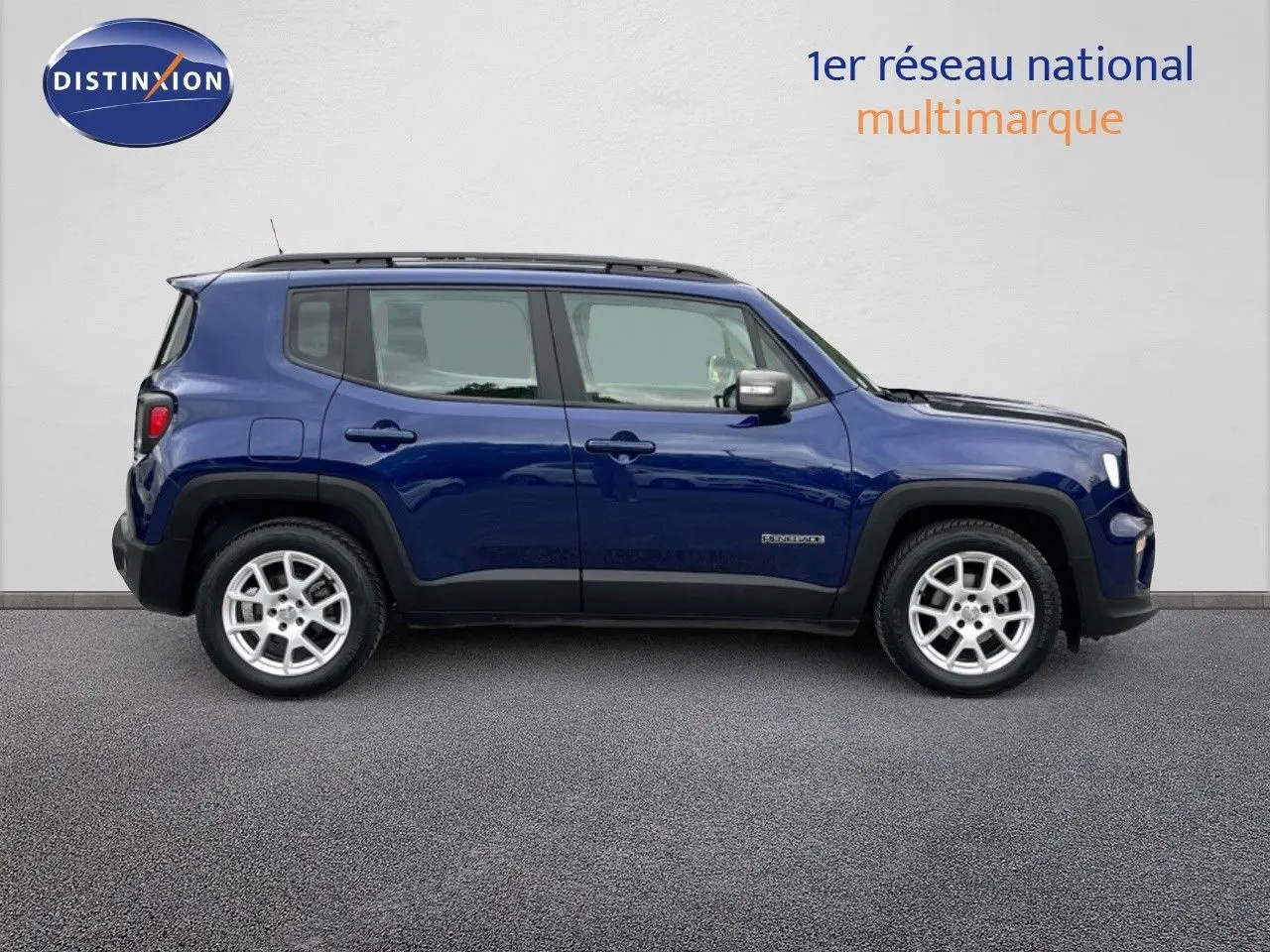 Jeep Renegade bleu en profil côté gauche, version Limited 1.0 essence 120ch avec jantes argentées visibles.