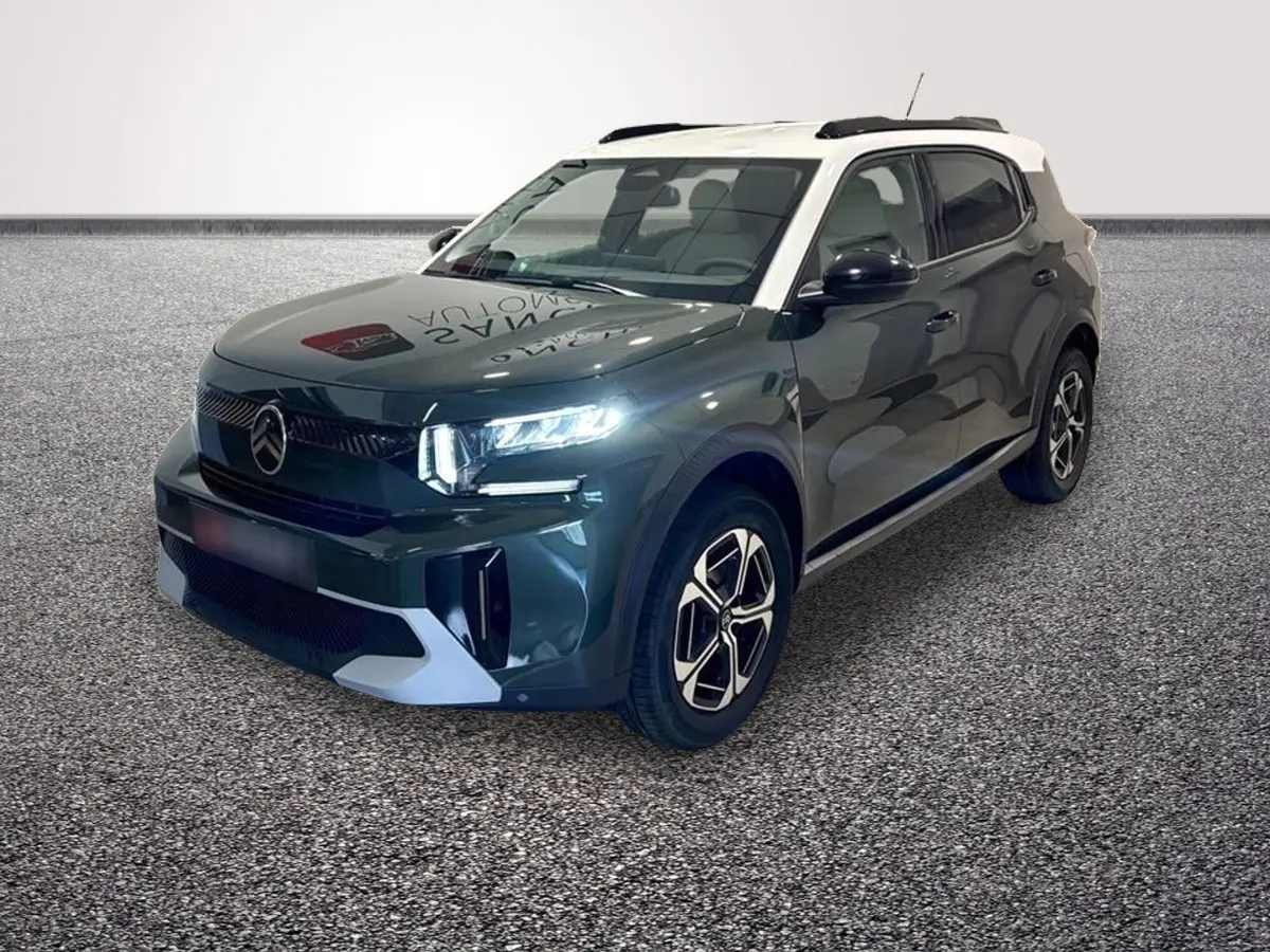SUV Citroën C3 Aircross hybride vert 3/4 avant droit avec toit blanc et feux LED allumés.