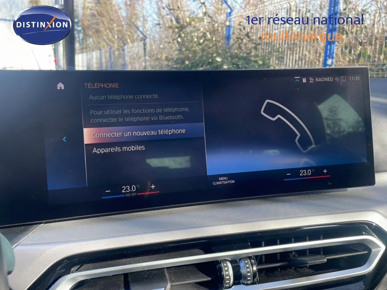 Écran tactile central de la BMW Série 3 Touring F31 316d noir, affichant le menu de connexion Bluetooth et la climatisation à 23°C.