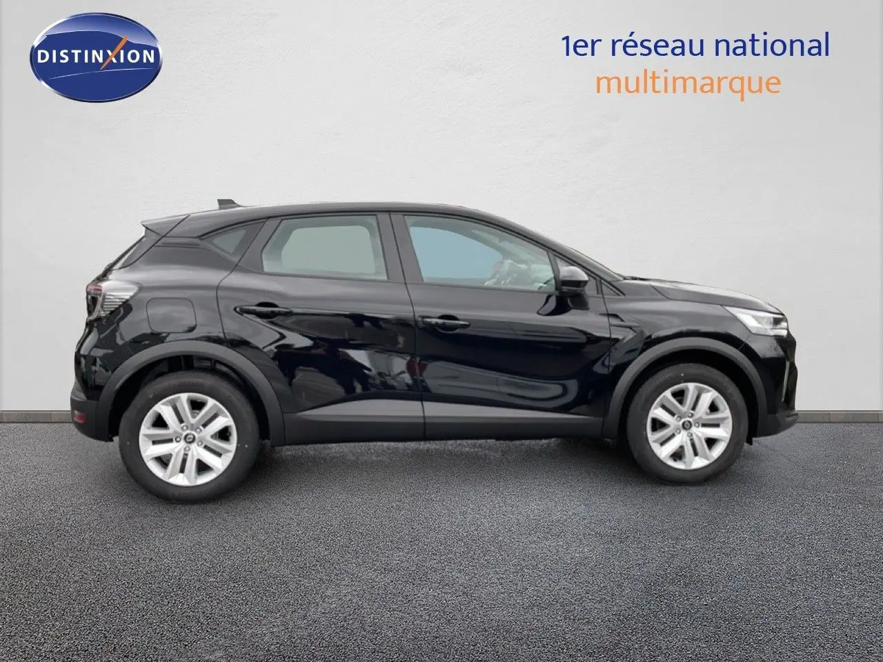 Profil droit d'un Renault Captur noir étoile métal 2025, SUV compact avec jantes alliage et lignes modernes.