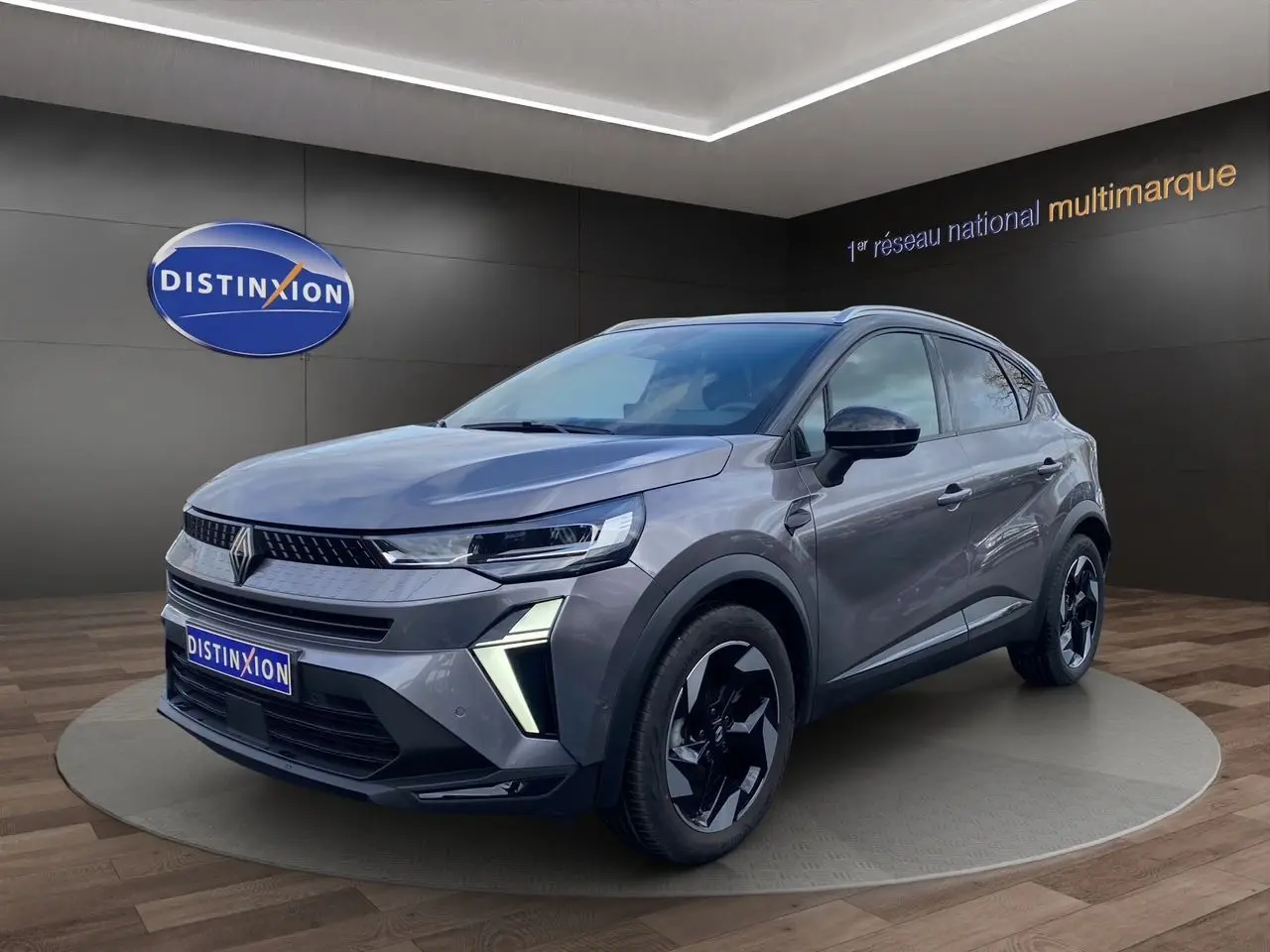 Renault Captur Eco-G 100 Techno gris cassiopée toit noir, vue 3/4 avant avec barres de toit et jantes alu noires.