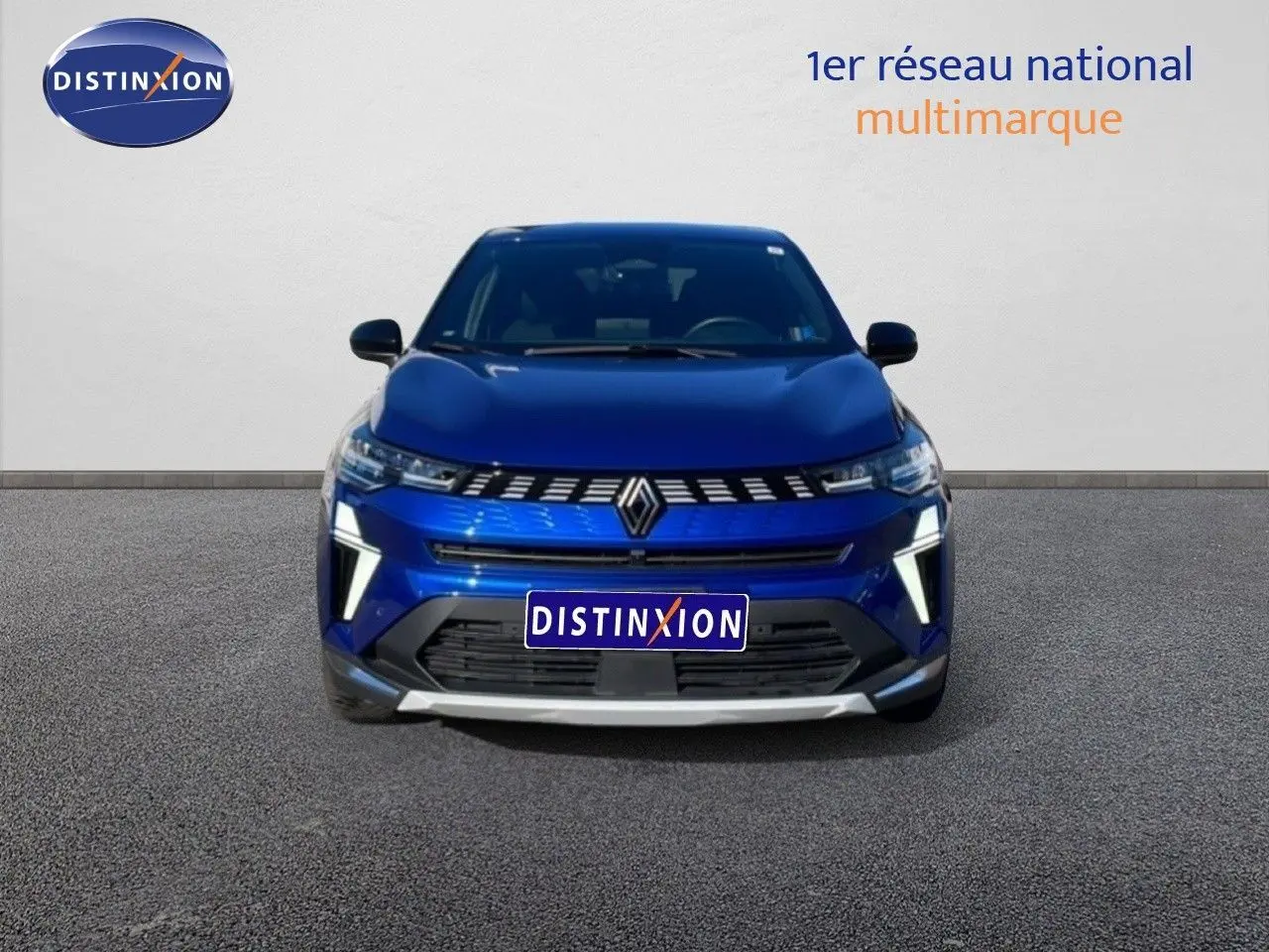 Vue de face du Renault Symbioz bleu iron metal 2025 avec calandre distinctive et éclairage LED vertical.