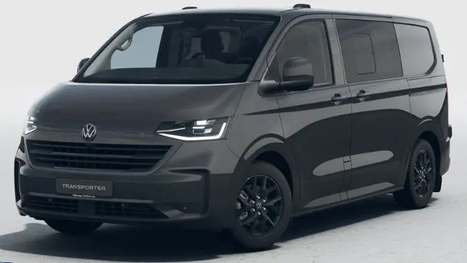 Vue 3/4 avant droite du Volkswagen Transporter ProCab gris métallisé avec jantes alliage noires et phares LED Matrix allumés.