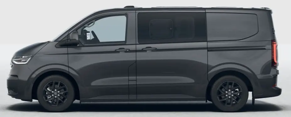 Vue de profil côté gauche d'un Volkswagen Transporter ProCab gris métallisé avec jantes alliage noires et vitres arrière assombries.