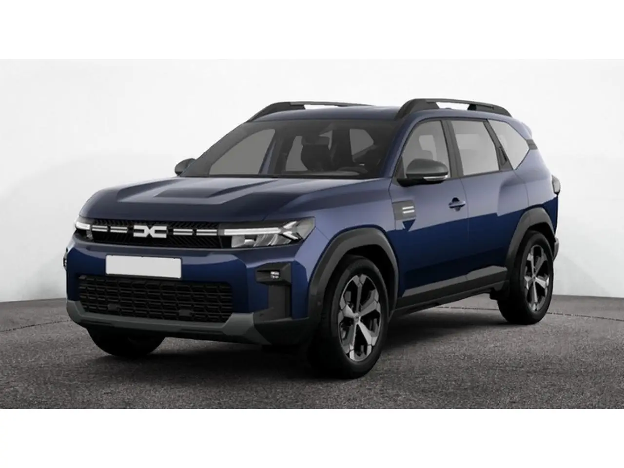 Vue 3/4 avant du Dacia Bigster 2026 bleu indigo avec roues alliage et toit noir contrasté.