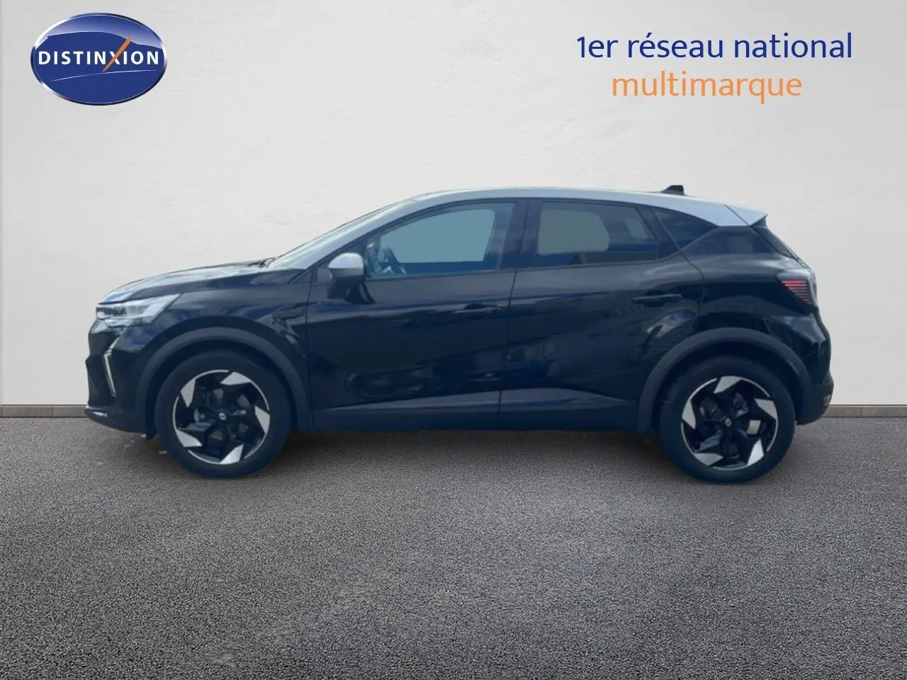 Profil côté gauche d’un Renault Captur noir étoile métal avec toit gris, roues bi-ton et lignes modernes.