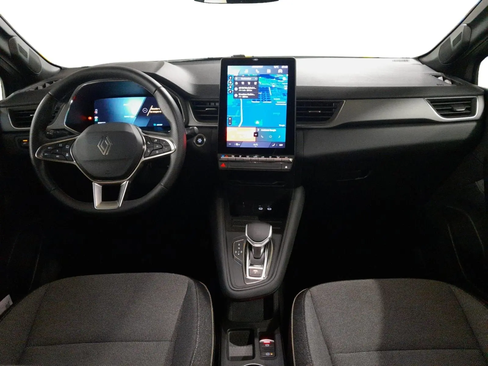 Vue intérieure avant du Renault Symbioz E-Tech Full Hybrid 145 avec tableau de bord numérique et écran tactile vertical.