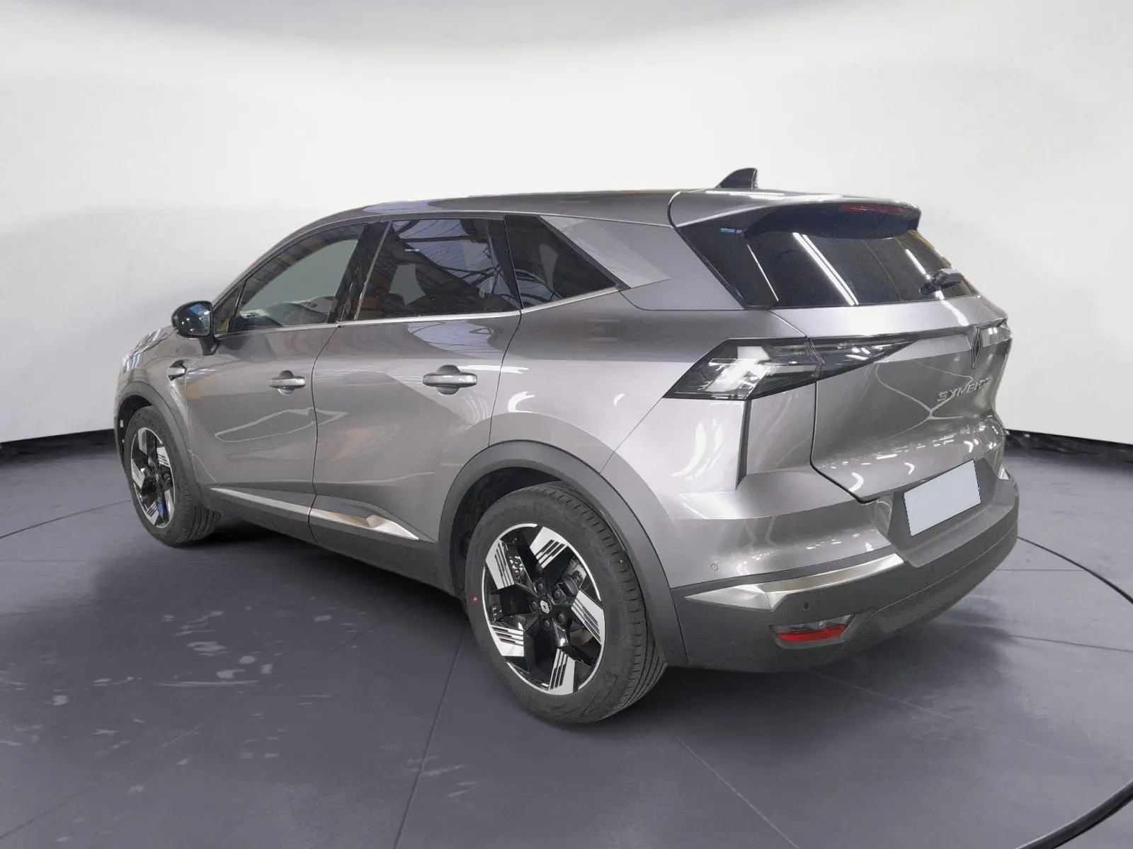 Renault Symbioz E-Tech Full Hybrid gris Casiopee, vue 3/4 arrière droit avec jantes alliage 18'' diamantées.