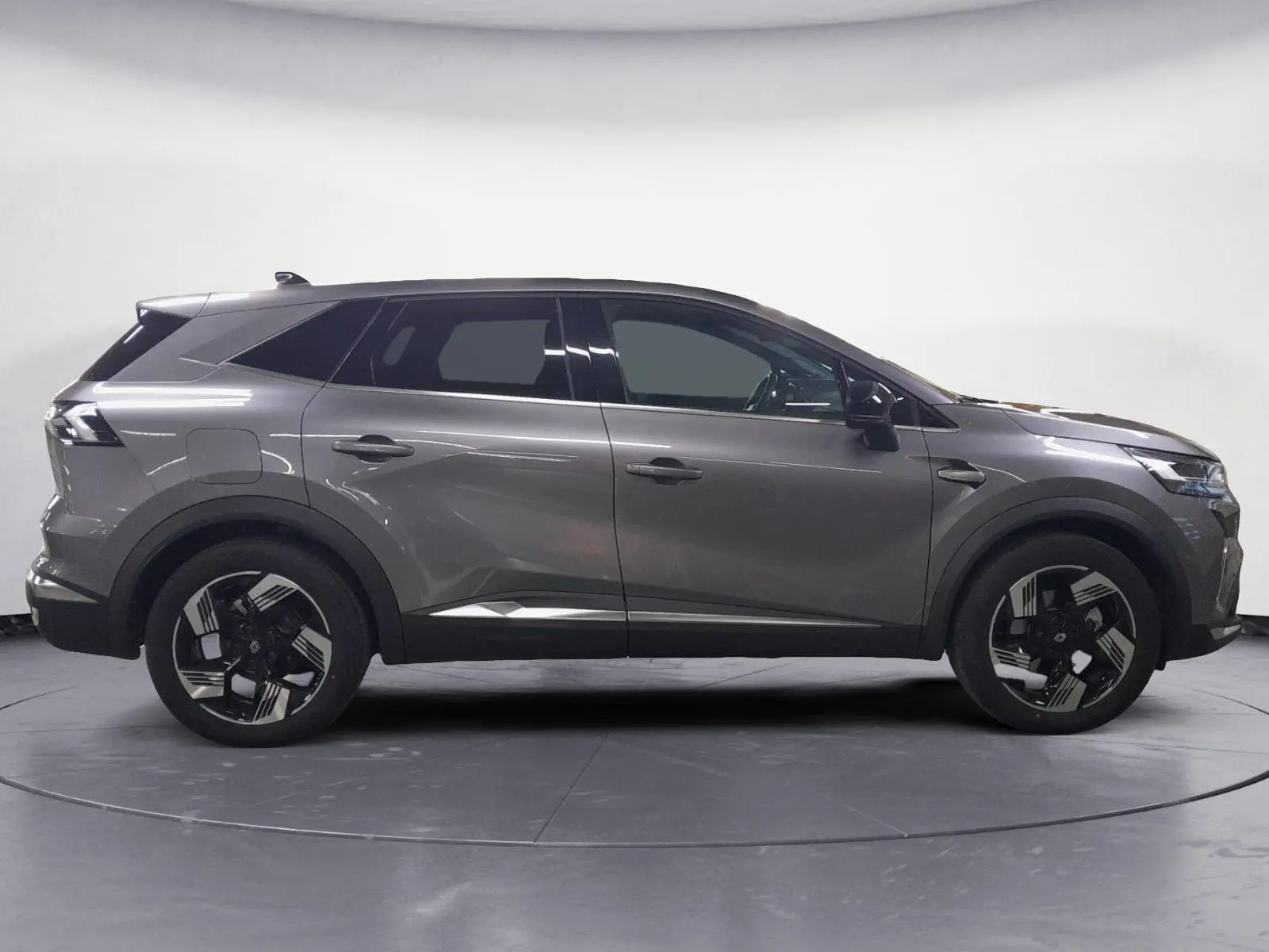 Renault Symbioz gris Casiopee en profil droit, soulignant ses jantes alliage 18'' diamantées et lignes modernes.