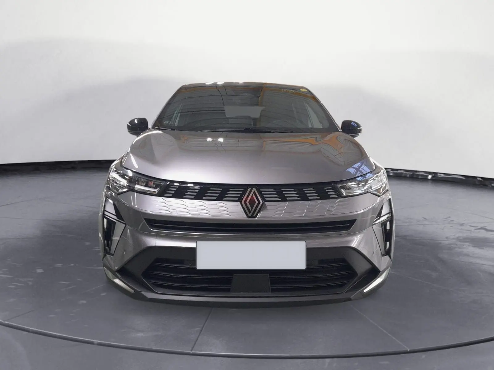 Renault Symbioz E-Tech Full Hybrid gris Casiopee vu de face, avec calandre moderne et phares LED fins.