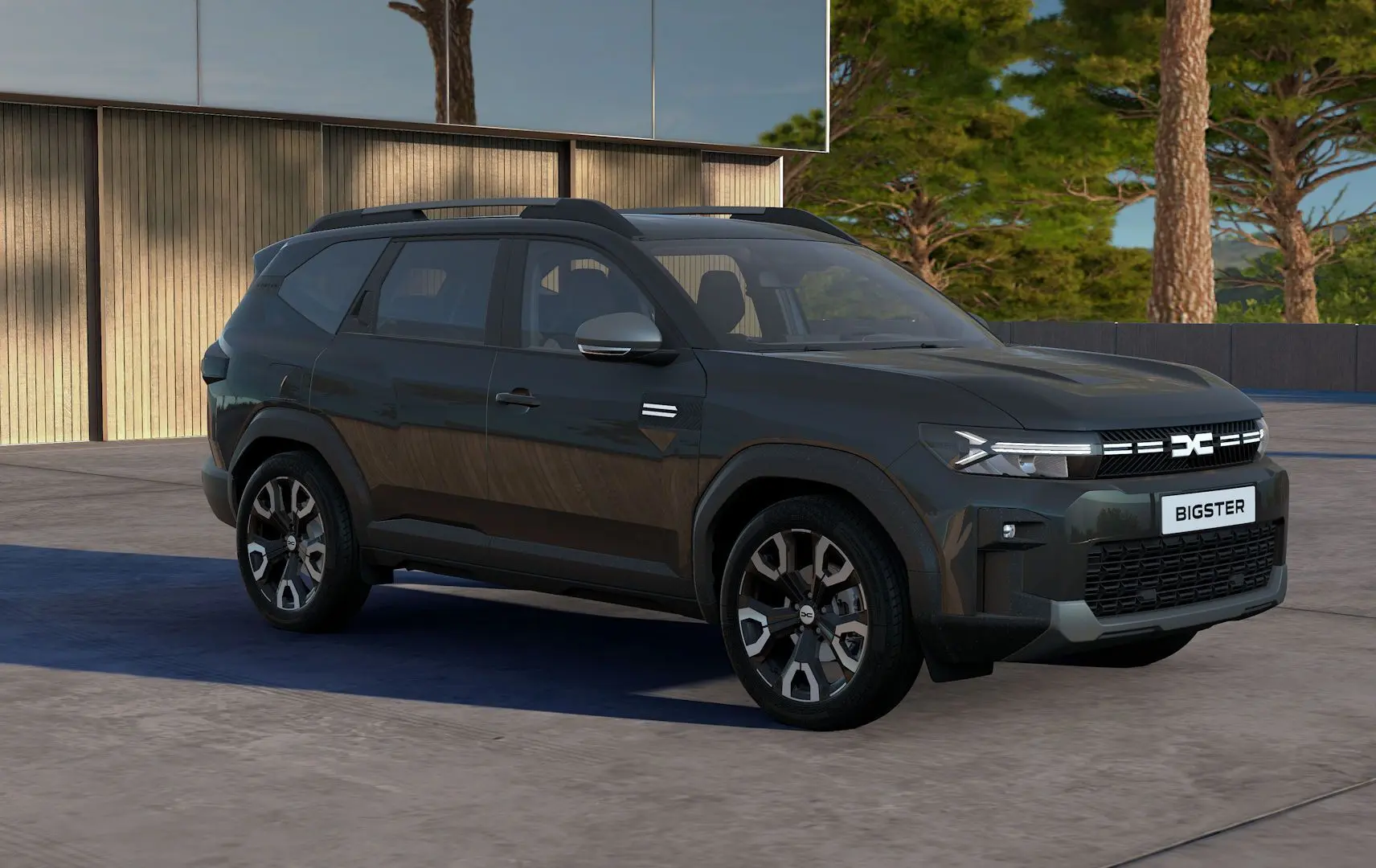 SUV Dacia Bigster Hybrid 155 Journey noir nacré en 3/4 avant droit, avec calandre lumineuse et jantes distinctives.