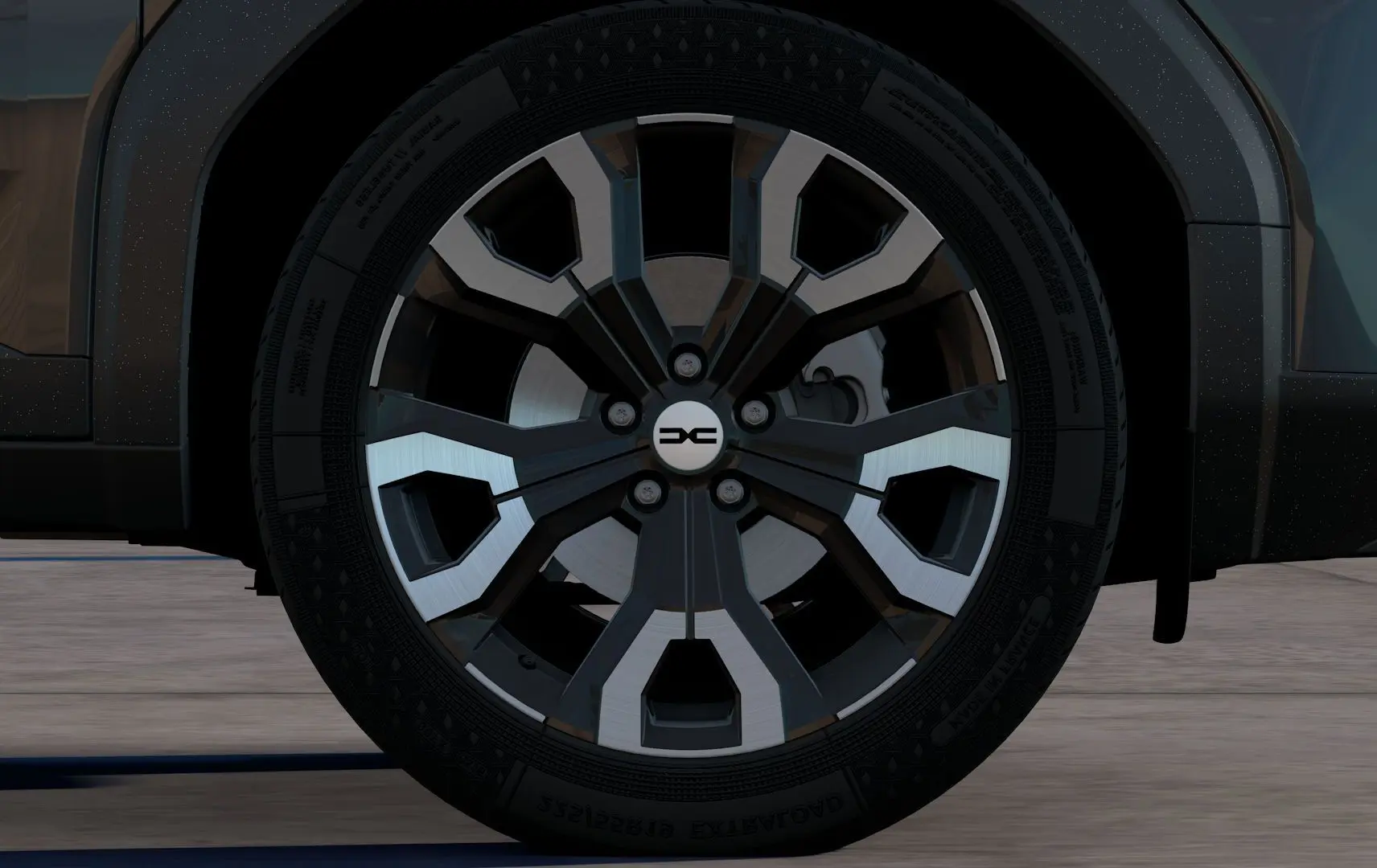 Gros plan sur la roue avant droite du Dacia Bigster noir nacré 2026, mettant en valeur la jante au design moderne bicolore.