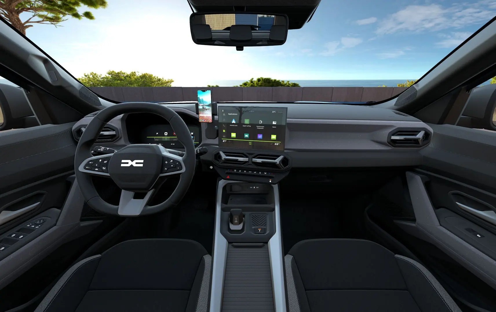 Vue intérieure avant du Dacia Bigster Hybrid 155 Journey noir nacré, avec tableau de bord moderne et écran tactile central.