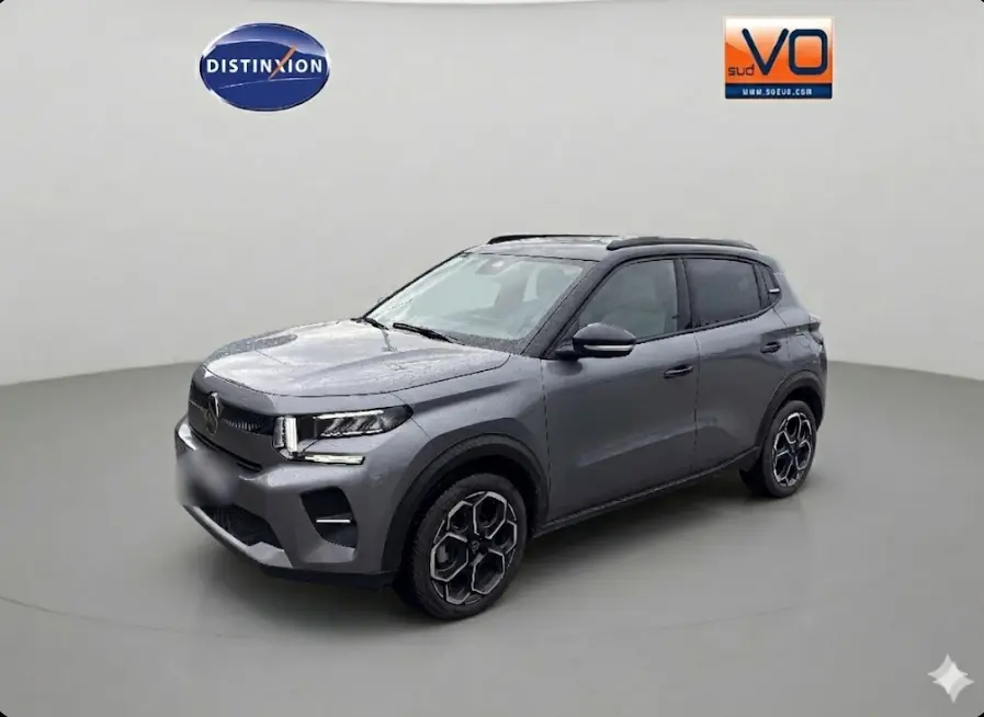 Citroën C3 Turbo 100 ch gris, vue 3/4 avant droit, avec barres de toit et jantes alliage 17 pouces.