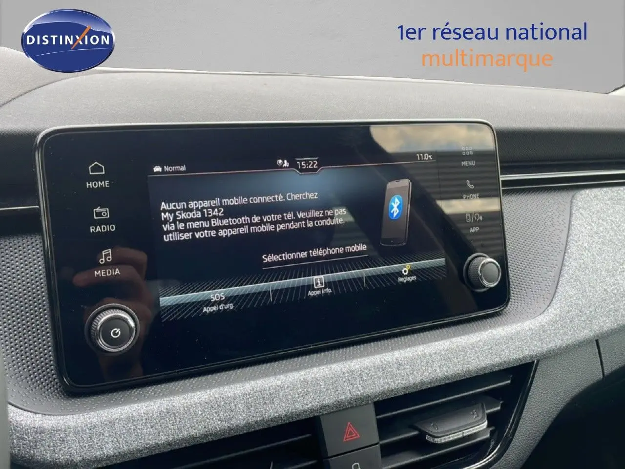 Écran tactile central du tableau de bord du Skoda Kamiq 2025, affichant le menu Bluetooth et les réglages.