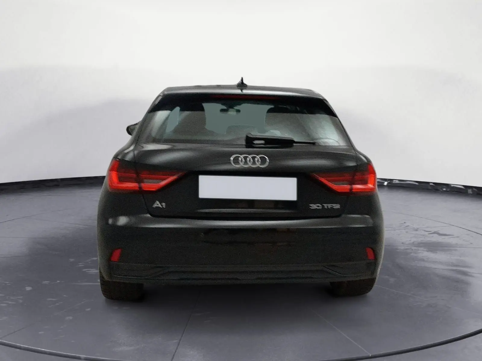 Audi A1 Sportback noir/gris vue de profil côté gauche, avec jantes alliage et lignes épurées.