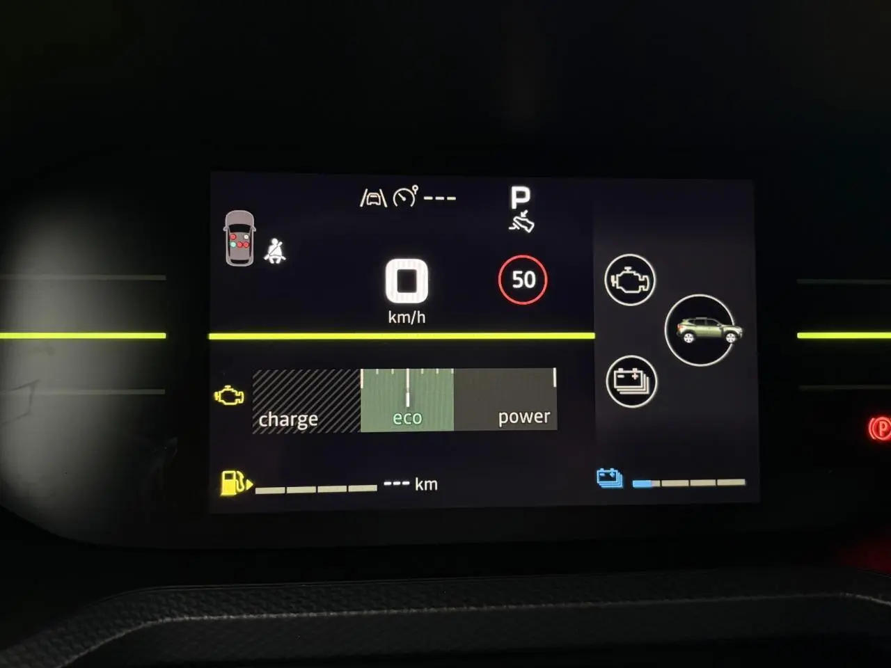 Tableau de bord digital du Dacia Duster gris Schiste, affichant la vitesse à 0 km/h et mode éco actif.