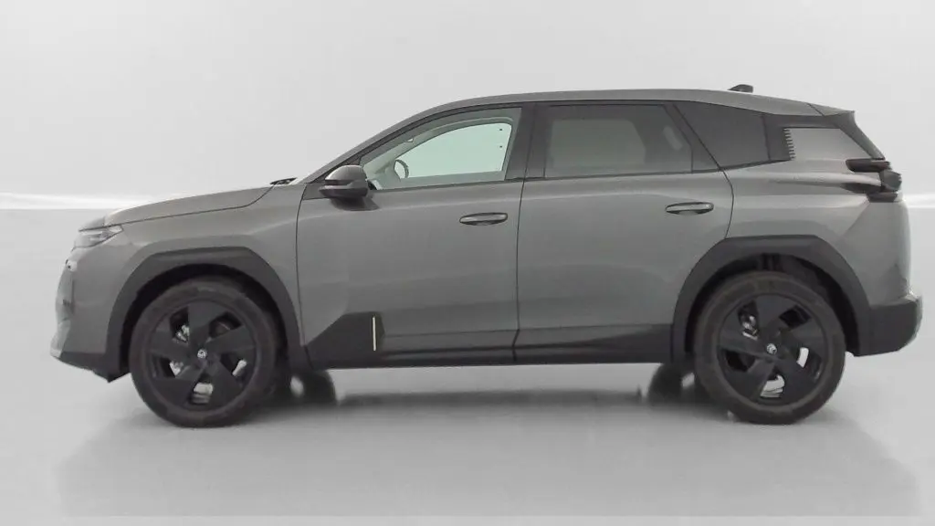 Vue de profil côté gauche d'un Citroën C5 Aircross hybride gris platinium avec jantes noires et détails noirs contrastants.