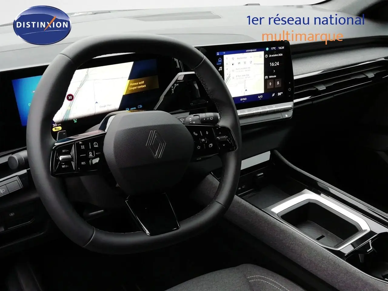 Vue intérieure du tableau de bord du Renault Austral gris schiste, avec volant multifonction et écran tactile central.