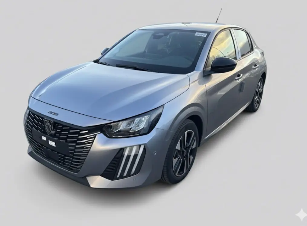 Peugeot 208 Hybrid gris vue 3/4 avant droit, avec calandre noire distinctive et jantes alliage 16 pouces.