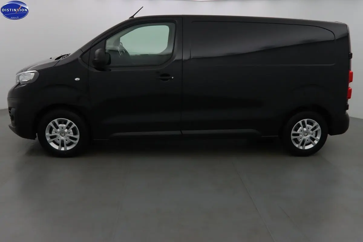 Profil droit d'un Peugeot Expert Fourgon noir métal 2022, finition Premium, avec jantes argentées et porte latérale coulissante.