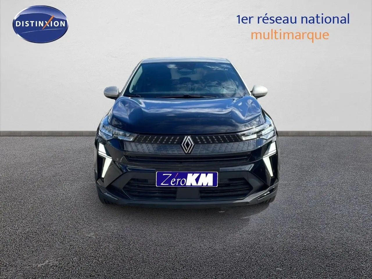 Vue de face d'un Renault Captur 2025 noir étoile métal avec toit gris et feux LED allumés.